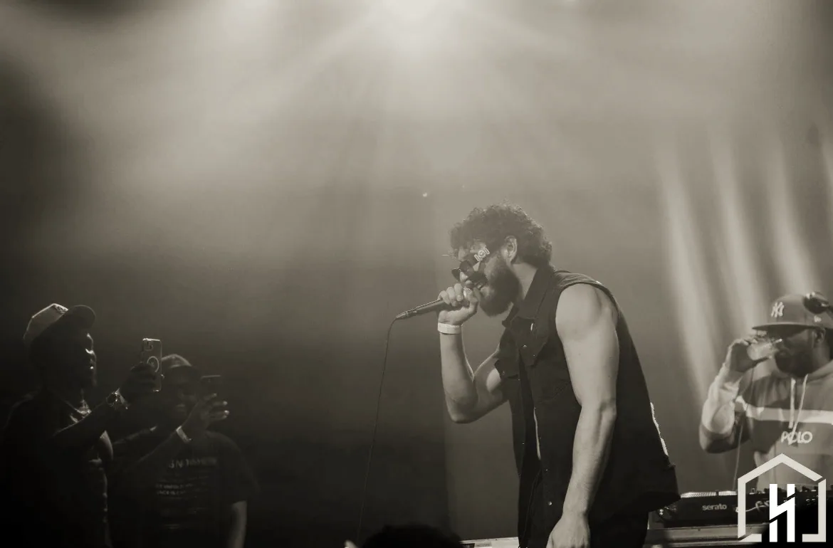 Young Benny performing live under stage lights