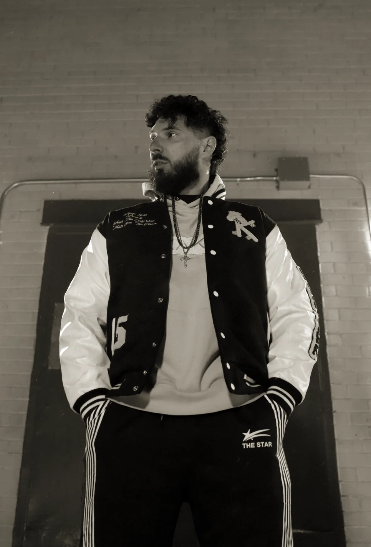 Young Benny in a varsity jacket - studio portrait