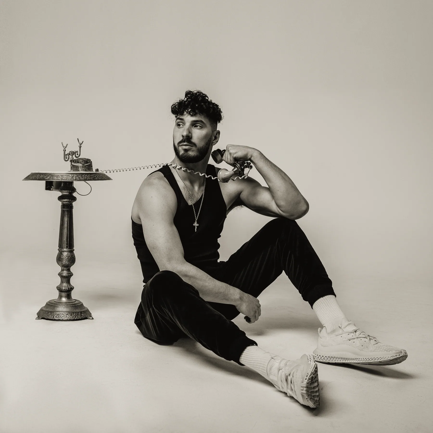 Young Benny in the studio with a vintage gold telephone